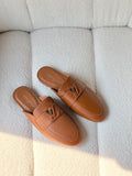 Louis Vuitton LV Emblem Grained Leather Mules