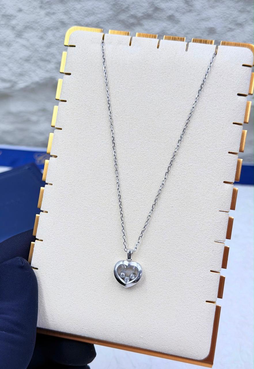 Chopard Happy Diamonds Heart Pendant Necklace — White-Tone Metal with Three Floating Stones and Pavé-Set Heart Border.