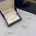 Chopard Ice Cube-Inspired Four-Piece Jewelry Set — -Tone Bar Pendant Necklace, Matching Stud Earrings, Chain Bracelet & Band Ring with Geometric Cube Detailing and Sparkling Stone Accents.