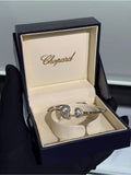 Chopard Happy Diamonds Happy Hearts Open Cuff Bracelet — White-Tone Metal with Pavé-Set Heart Motifs and Floating Stone Details.