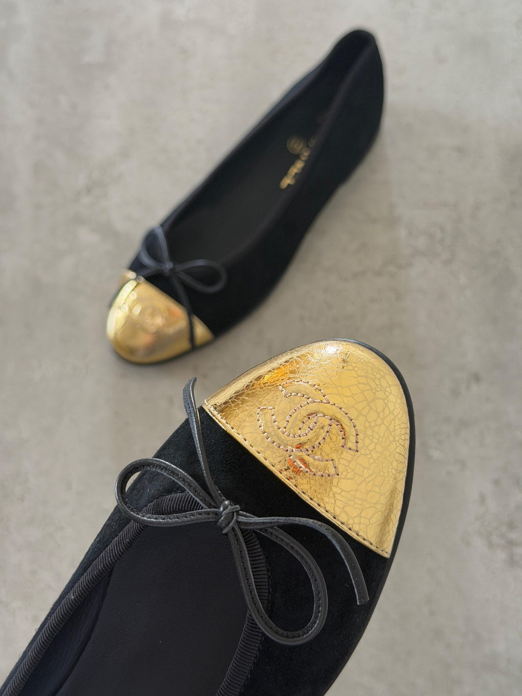 Chanel Black & Gold Cap-Toe Ballet Flats with Bow & CC Logo