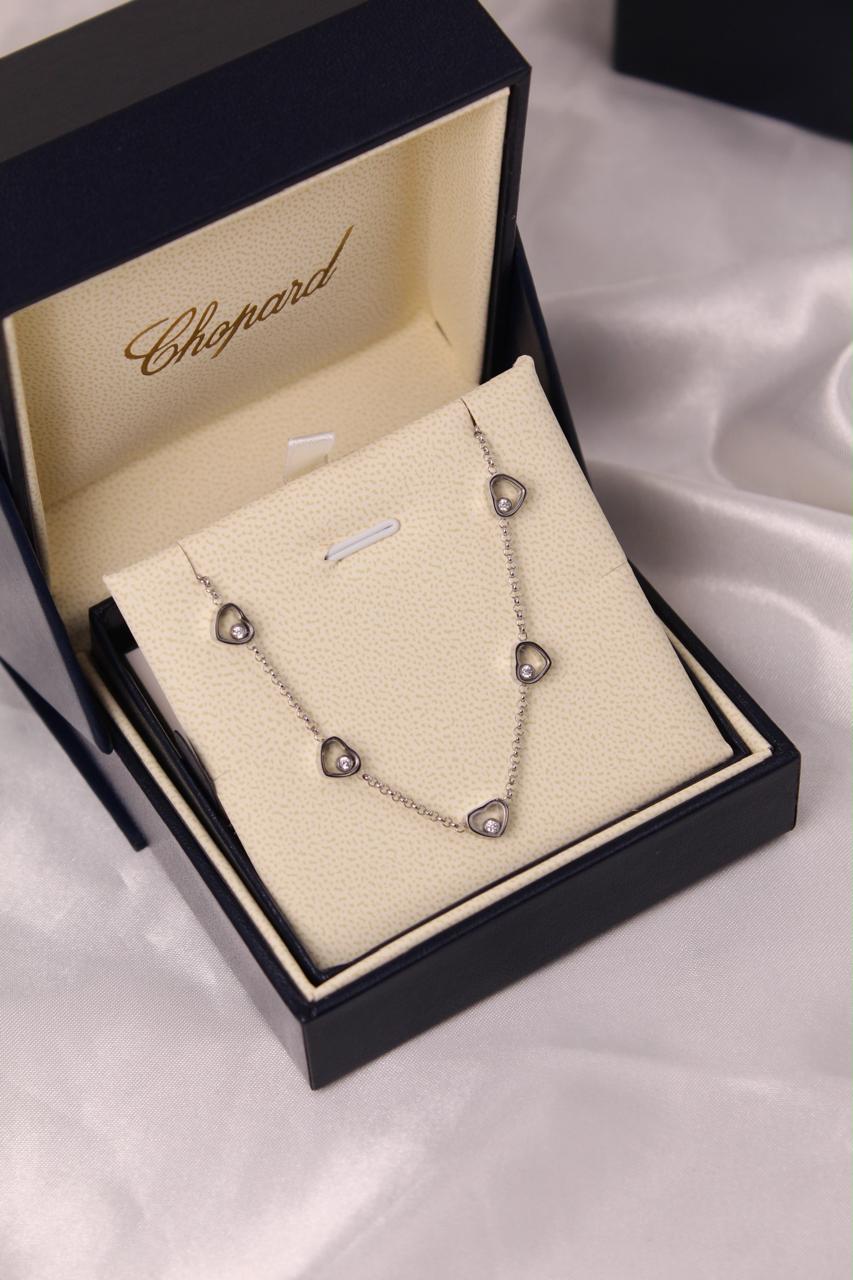 Chopard Happy Diamonds Happy Hearts Five-Heart Necklace — with Floating Diamond Details.